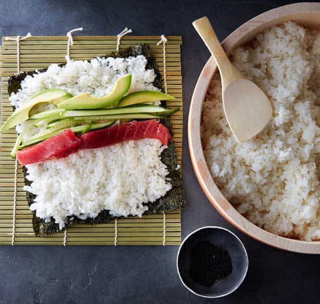 Why is rice vinegar important for making sushi rice